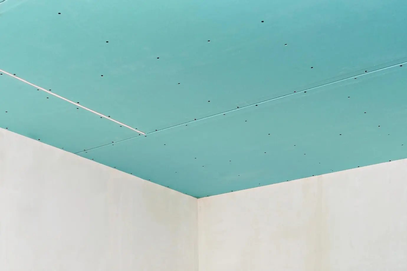 A plasterboard ceiling attached to an installed profile frame. For apartment or office renovations. A quick, low-cost way to create a partition or ceiling in a room or warehouse.